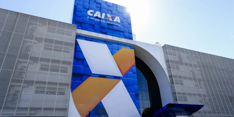 Fachada da agência da Caixa Econômica Federal, com logo e o slogan visíveis.