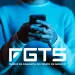 Mãos de uma pessoa segurando um smartphone com a logo do FGTS em destaque.