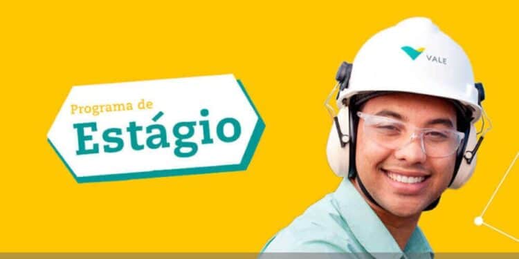 Jovem estagiário da Vale sorrindo com EPI, representando oportunidade de estágio.